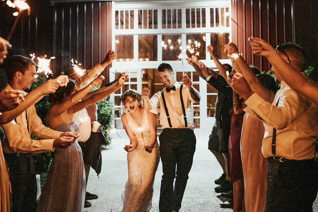 sparkler exit at their barn wedding venue in Michigan